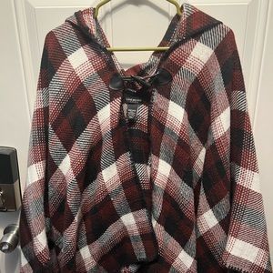 Red white and black poncho. One size fits most.
